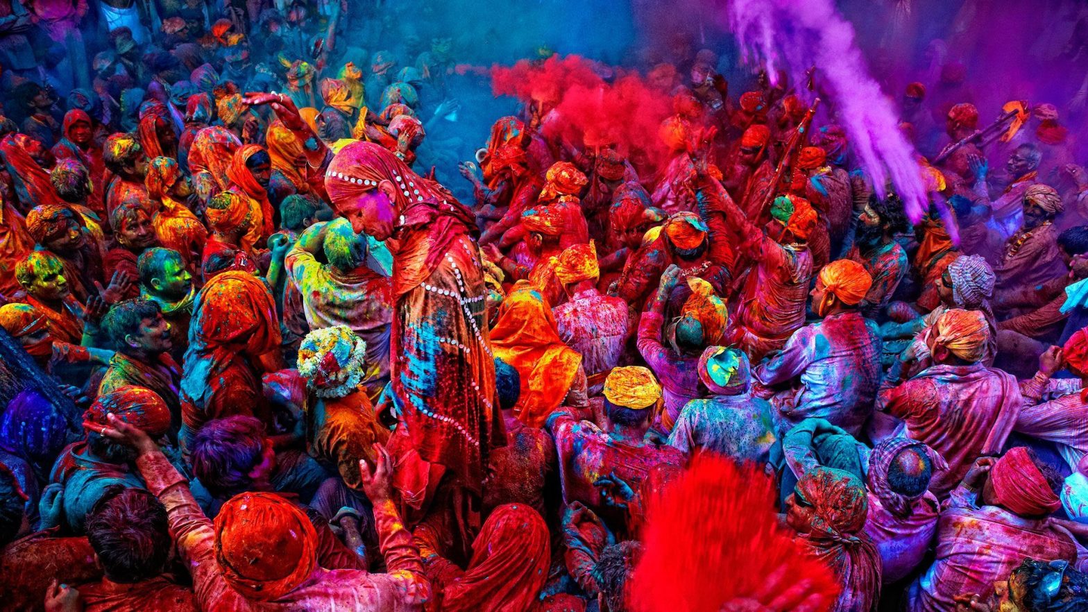 people celebrating holi festival with colors